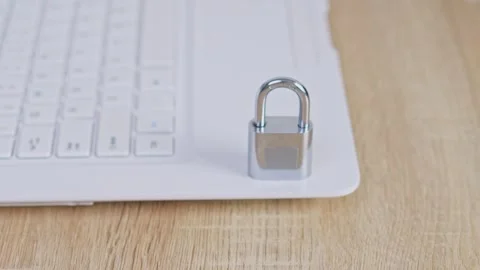 Cyber security Concept hand places padlock to laptop represent digital security Stock Footage 328549916