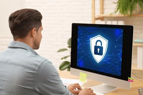 Cyber security concept. Man using application on computer in office Stock Photos