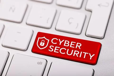 Cyber security concept on red button of white keyboard close-up Illustrazione stock