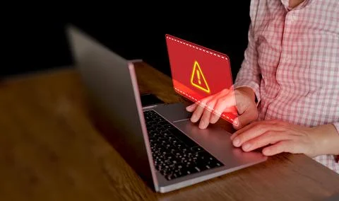 Cyber security concept. Red system hacked warning sign alerts on a computer.. Stock Photos