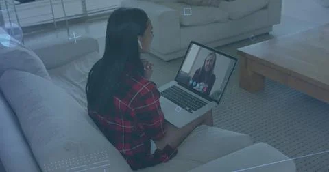 Cyber security data processing over african american woman having a imagecall on 写真素材