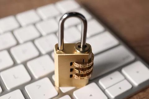 Cyber security. Keyboard with padlock on table, closeup 写真素材