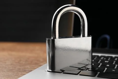 Cyber security. Laptop with padlock on table, closeup and space for text Stock Photos