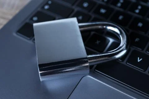 Cyber security. Laptop with padlock on table, closeup Foto stock