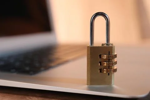 Cyber security. Laptop with padlock on table, closeup and space for text Stock Photos