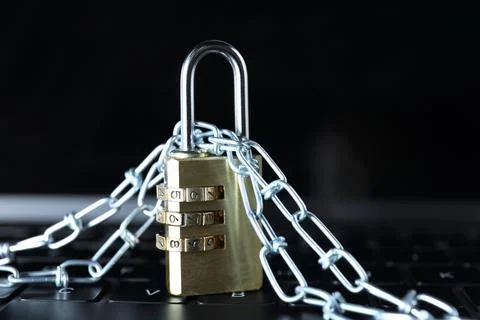 Cyber security. Padlock with chain on laptop, closeup Stockfoto's
