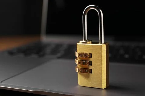 Cyber security. Padlock on laptop, closeup and space for text Stock Photos