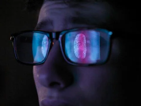 Cyber Security, reflection in spectacles  of access information being scanned on Stock Photos