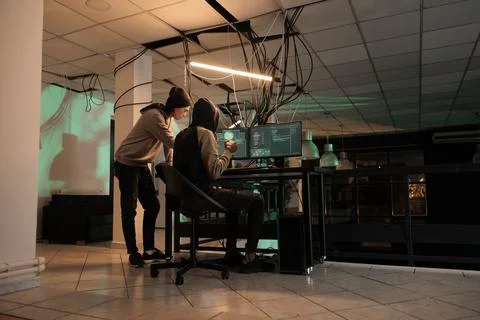 Cyber security specialists fixing computer system cyberattack Stock Photos