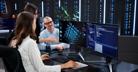 The Cyber Security Team Analyzing Data On Center's Main Screen. 스톡 사진