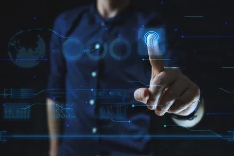 Cyber security technology concept. Man points finger at finger print scan Stock Photos
