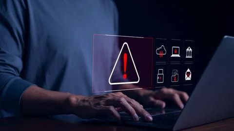 Cyber security warning alert system concept. Businessman working on laptop. Stock Photos