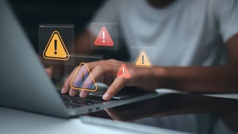Cyber security warning on laptop screen,System error notification while wor.. Stock Photos