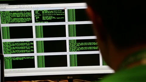 Cyber Tech  - Hacker or Programmer Looking at Split Screen Computers Stock Footage 74857923