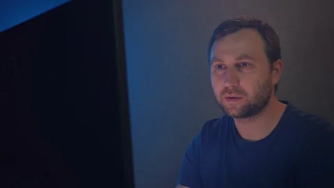 Cyber terrorist works on a computer in a dark office room. Stock Footage 90979854