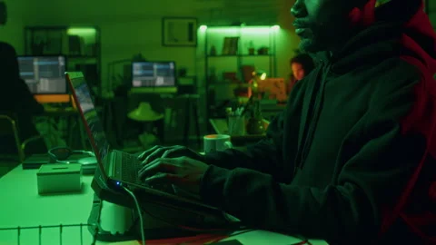 Cyber Thief Exploiting Network of Computer System Using Laptop in Office Stock Footage 299279103