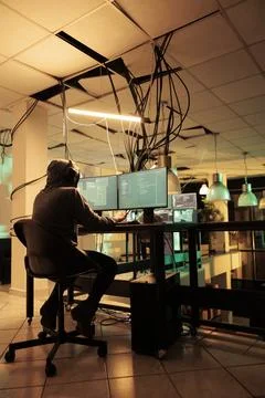 Cyberattack, hacker running malware code on computer, hacking database Stock Photos