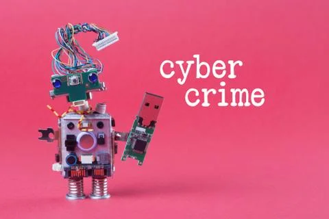 Cybercrime and data hacking concept. Retro robot with usb flash storage stick Stock Photos