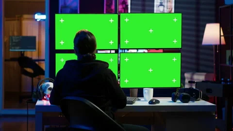 Cybercriminal coding on green screen monitors, developing zero day exploit Stock Footage 275863697