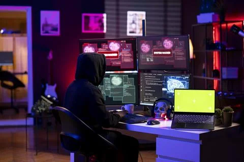 Cybercriminal doing phishing attacks using green screen laptop Stock Photos