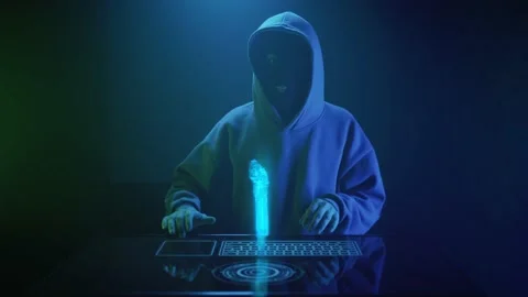 A cybercriminal hacker in a black mask hacks a pistol Vídeos de archivo 201611461