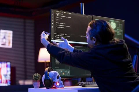 Cybercriminal inserting USB stick in PC with stealth malware Stock Photos