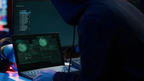 Cybercriminal opening notebook to exploit network backdoors, close up Foto stock