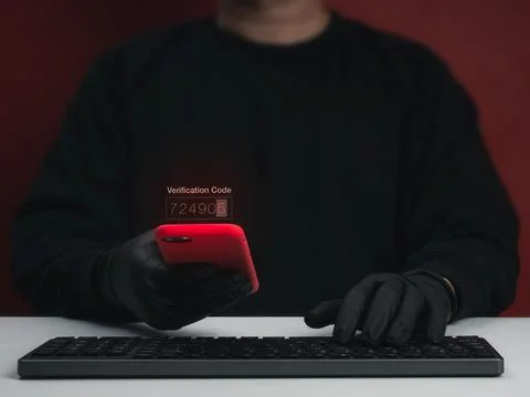 Cybercriminal scammer using smartphone with verification code. MFA code the.. Photos