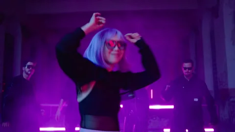 Cyberpunk: Asian model dancing at a shady lost place in front of a crowd 動画素材 280440620