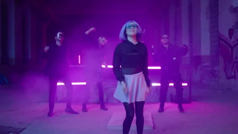 Cyberpunk: Asian model dancing at a shady lost place in front of a crowd 動画素材 280440702