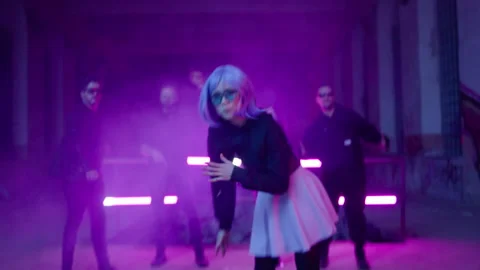 Cyberpunk: Asian model dancing at a shady lost place in front of a crowd 動画素材 280441832