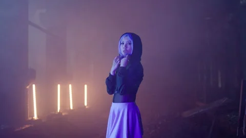 Cyberpunk: Asian model with a hood posing at a shady lost place 動画素材 280444079