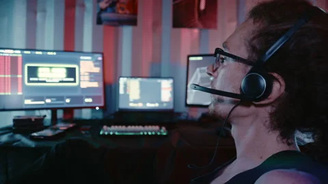 Cyberpunk Computer Operator Communicating at Multi Monitor Workstation Stock Footage 341657592