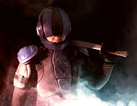 Cyberpunk future concept. Bionic cyborg police officer with short samurai sword Foto stock