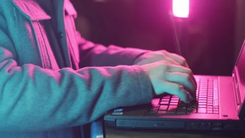 Cyberpunk hacker with laptop Stock Footage 230587897