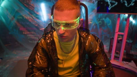 Cyberpunk Hacker in Smart Glasses Stealing Data on Computer in Dark Room Stock Footage 327633212