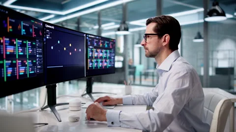 Cybersecurity Analyst Carefully Monitors Network Threats Stock Footage 334536828