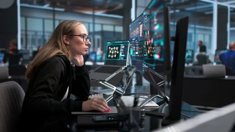 Cybersecurity Analyst Carefully Monitors Network Threats Stock Footage 340400071
