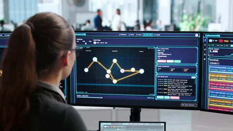 Cybersecurity Analyst Carefully Monitors Threat Detection Software Stock Footage 343889263