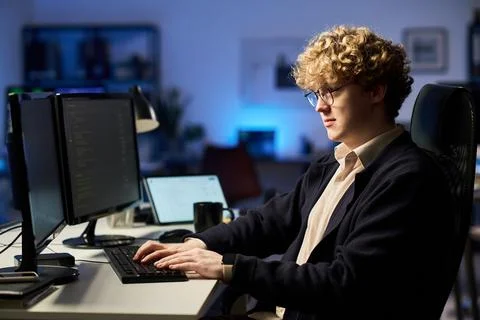 Cybersecurity Analyst Coding on Computer Monitors in Office Stock Photos