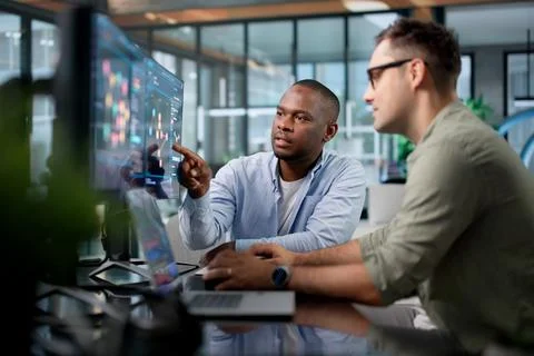 Cybersecurity Analyst Discusses Malware Threats While Monitoring Network On L Stock Photos