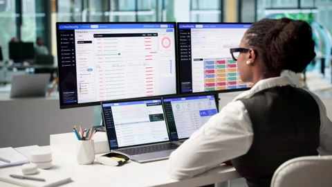 Cybersecurity Analyst Monitors Cloud Platform Risks Using Laptop Stock Footage 346322628