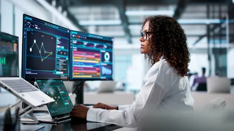 Cybersecurity Analyst Monitors Network Threats Using Laptop Stock Footage 339910858