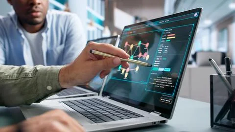 Cybersecurity Analyst Monitors Network Threats Using Advanced Software Tools. Stock Photos