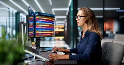 Cybersecurity Analyst Studies Network Threats Carefully Using Laptop At Work. Stock Photos