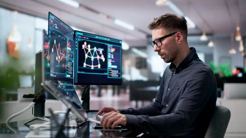 Cybersecurity Analyst Uses Dual Touchscreen Laptops Monitoring Network Threats Stock Footage 340397747