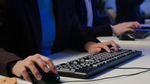 Cybersecurity Analysts Typing on Computer Keyboards in Office Stock Footage 347317657