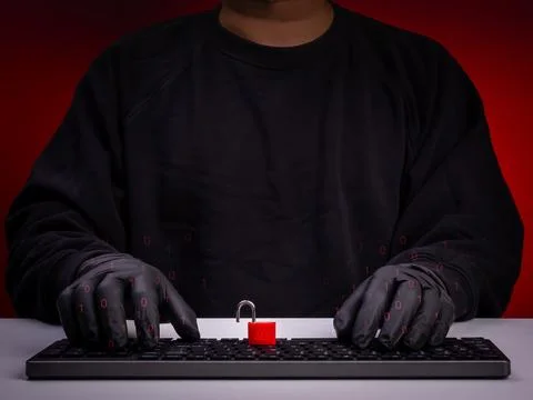 Cybersecurity and data breach concept showing anonymous hacker wearing glov.. 스톡 사진