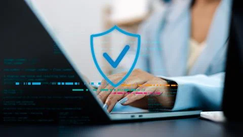 Cybersecurity and Data Protection Concept with Shield Icon on Laptop Screen 스톡 사진