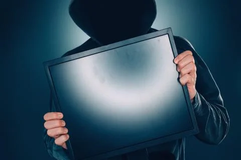Cybersecurity, computer hacker with blank computer monitor screen Stock-Fotos